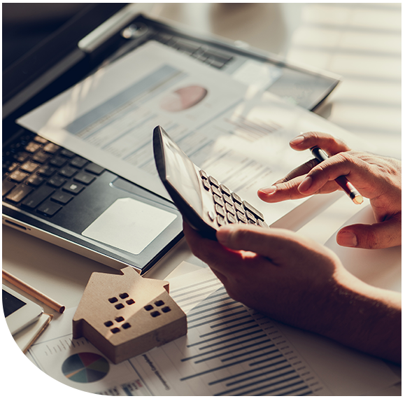 Mortgage planning materials next to a home model